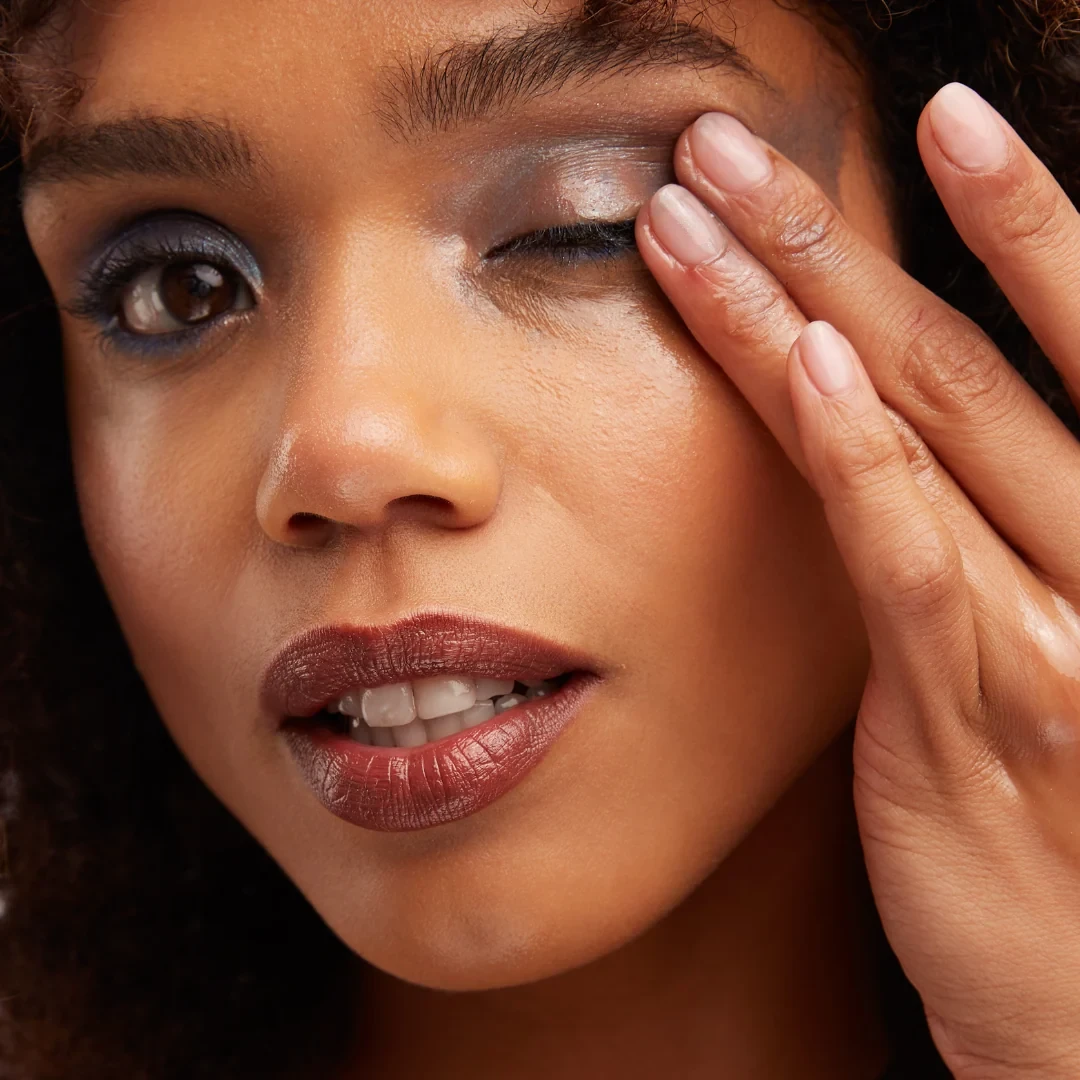 Wiping off eye makeup with the fingertips — long-wear makeup, waterproof mascara and water-resistant sunscreen are when a first cleanse before your cleanser is needed